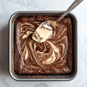 Steps to make cheesecake brownies, including batter preparation and layering